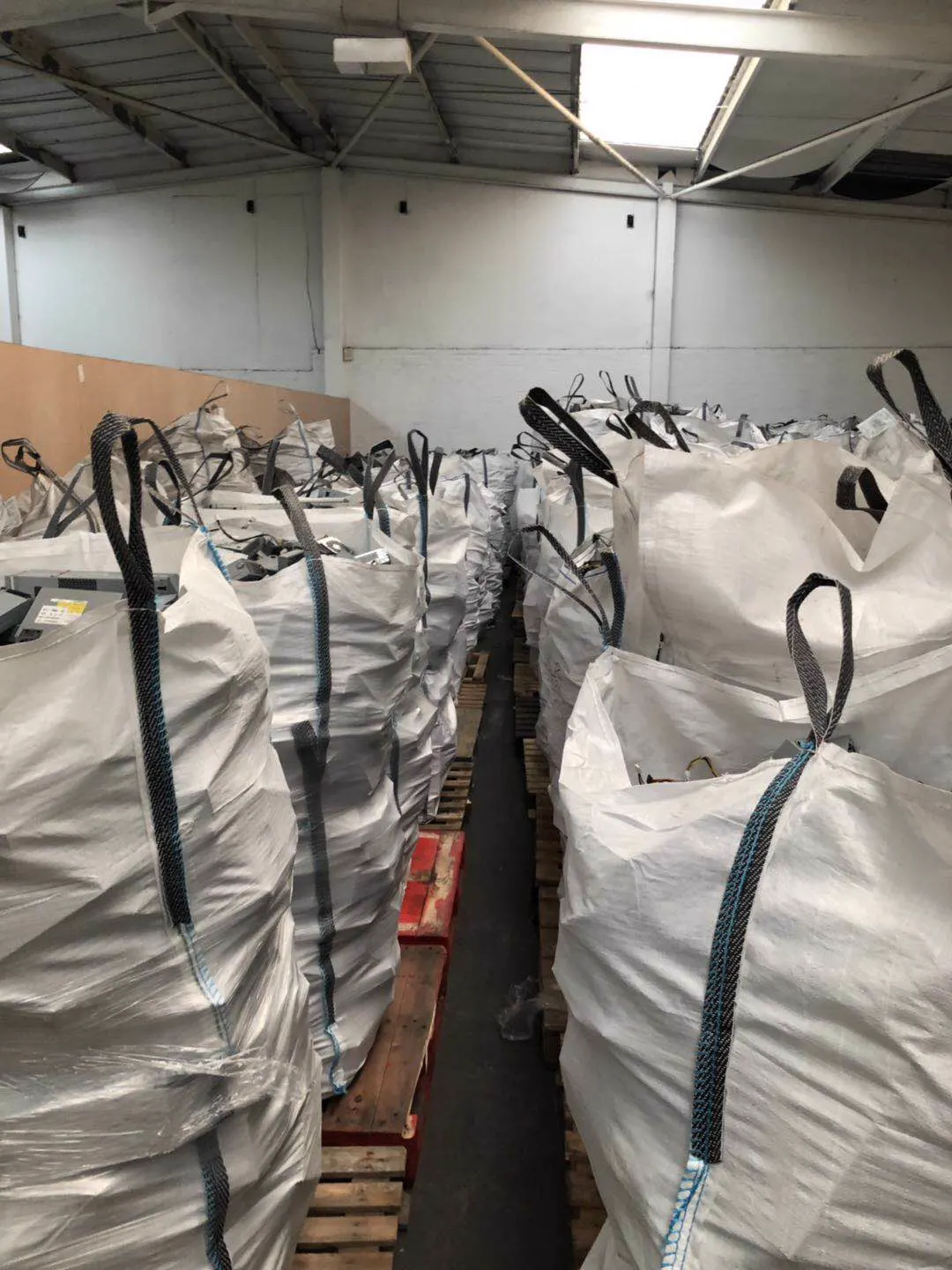 Power supplies sorted into bulk bags.